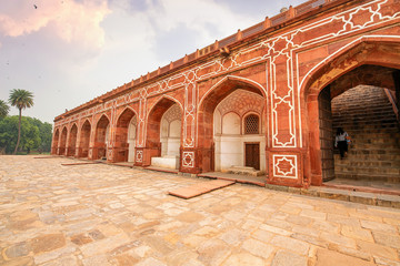 Fototapete - Medieval architecture made of red sandstone and marble at Humayun Tomb Delhi at sunset