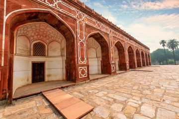 Fototapete - Ancient Indian architecture made of red sandstone and marble at Humayun Tomb Delhi at sunset