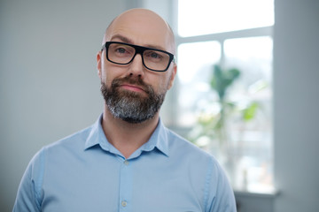 Poster - Bearded middle-aged man wearing glasses.