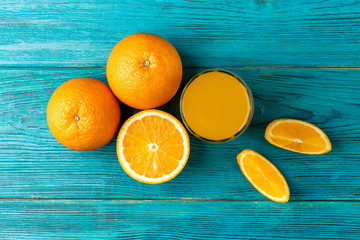 Wall Mural - Orange juice on  wooden background. 