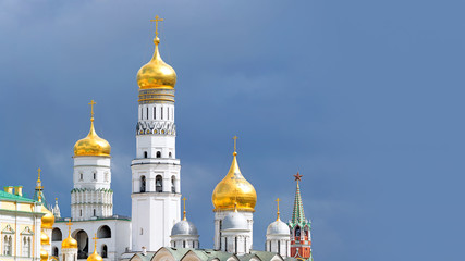 Wall Mural - moscow city kremlin russia golden domes and red star clock tower skyline against blue clouds sky background russian old town retro architecture cathedral famous country sign 8K UHD panorama concept