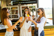 © BGStock72 - Three pretty young women drinking coctais in beach bar