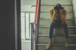 © TeTe Song - Unhappy depressed teenager with face in hands sitting stair at old condo, thinking about problem with relationships or work, feeling despair and anxiety, loneliness, having psychological trouble