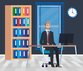 Poster - professional businessman with computer in the desk and bookcase