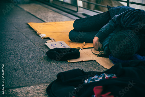 Beggars Homeless People Lying On The Floor On An Overpass Asking