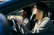 © Westend61 - Two women driving in a car