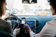 © Westend61 - Two women driving in a car through the city