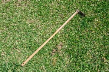 Gardening Tools on grass green background.