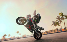 Moto Rider Making A Stunt On His Motorbike. Biker Doing A Difficult And Dangerous Stunt.