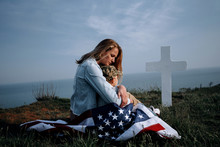 Mother With Son In The Cemetery Near The Grave Of The Father Of The American Soldier Who Died In The Ridge Point Defending The Sovereignty And Independence Of The United States Of America