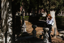 Woman Crying In The Graveyard By A Deceased Relative