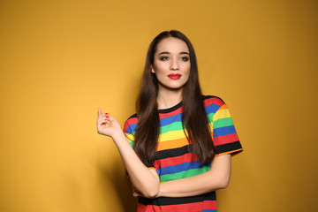 Canvas Print - Portrait of beautiful young woman on colorful background