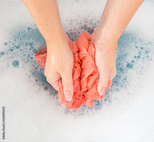 Female Hands Washing Color Clothes In Sink Buy This Stock