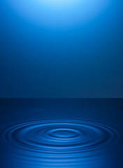 circles on the water from drops. blue background