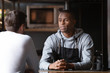 © fizkes - African chef talking with caucasian male vacancy candidate in restaurant