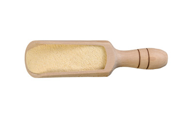 semolina in wooden scoop isolated on white background. nutrition. natural food ingredient. top view.