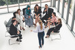 © InfiniteFlow - Businesswomen and businessmen attending group meeting conference in office room. Corporate business team concept.