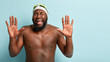 © WHstudio Leushin N - Desperate sportsman frustrated to loose swimming competition, shouts from negative emotions, closes eyes, has widely opened mouth, shows palms, has naked body, wears goggles and rubber swimhat