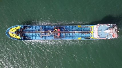 Wall Mural - Large crude oil tanker cruising across The Mediterranean sea - Aerial footage following the ship