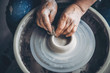 © Parilov - Place to work. Top view potter making ceramic pot on the pottery wheel