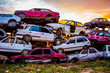 Pile of discarded old cars on junkyard