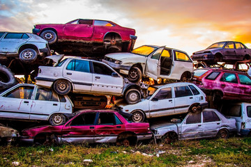 Pile of discarded old cars on junkyard