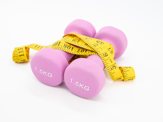 Fitness equipment with dumbbells and measuring tape isolated on a white background. Healthy with exercise concept.