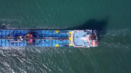 Wall Mural - Large crude oil tanker cruising across The Mediterranean sea - Aerial footage following the ship