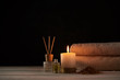 © Lazy_Bear - Towels, candle and massage oil on white table