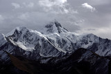 Fototapeta Fototapety góry  - Minya Konka (Mount Gongga, Epic Tibetan Snow Mountain) - Gongga Shan in Sichuan Province, China. View from the west at Yaha Pass, summit shrouded in clouds. Highest Mountain in Sichuan Province China.