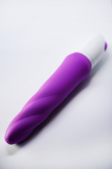 Bright sex toys on white background in the studio 