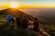 © LUIZ - Friends watching sunset on a mountain