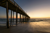 Fototapeta Zachód słońca - Ocean Pier in Golden Light of Sunrise