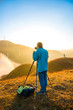 © 一飞 黄 - Photographers in the mountain wind turbines and sunrise and sunset cloud background