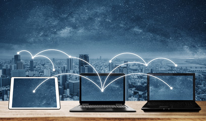 laptop computers with network connection and sharing data to other devices. internet networking and 