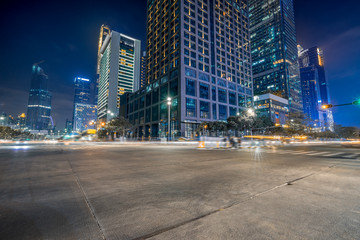 Wall Mural - empty concrete floor and cityscape at night