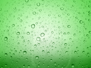 Canvas Print - Close-up of water drops on glass surface as background