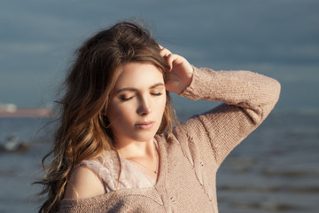 Relaxing woman. Perfect model girl on ocean coast