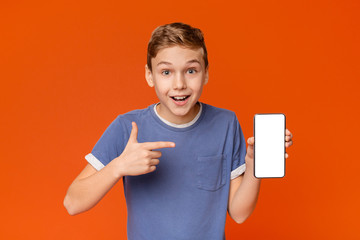 Cute boy man showing blank cellphone screen