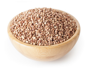 Roasted buckwheat grains in wooden bowl isolated on white background with clipping path