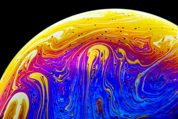 Wall Mural - multicolored rainbow colors of a single soap bubble that looks like a fantasy planet isolated agains