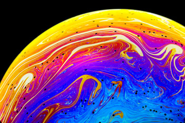 Wall Mural - multicolored rainbow colors of a single soap bubble that looks like a fantasy planet isolated agains