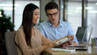 © motortion - Pretty businesswoman and assistant analyzing sales graphs, business teamwork