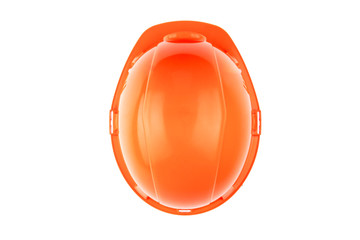 Orange construction helmet on a light background. The concept of architecture, construction, engineering, design. Copy space. top View