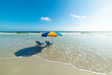 Beach Chairs And Parasol In Daytona Beach
