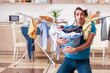 © Elnur - Young man husband doing clothing ironing at home