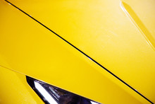 Car Headlights Of Yellow Sport Car. Exterior Detail