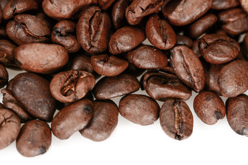 Wall Mural - Brown hard roasted coffee beans, macro close up, isolated on a white background