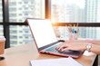 © feeling lucky - office wood desk with beautiful woman hands working on laptop computer with office supplies and coffee cup