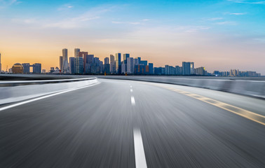 Wall Mural - Empty road floor surface with modern city landmark buildings of hangzhou bund Skyline,zhejiang,china